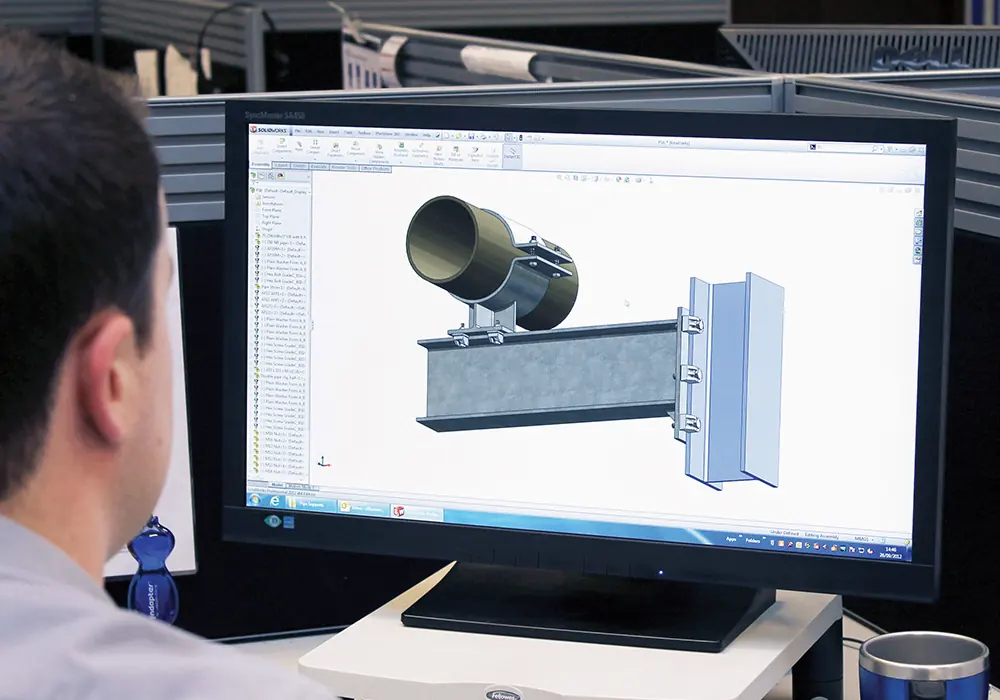 Engineer reviewing a 3D steel connection model