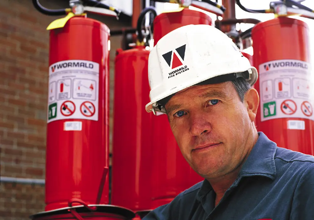 Wormald engineer with fire extinguishers